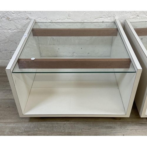 1168 - A pair of mid 20th century white laminate and glass top side tables - approx. 40cm high x 62cm wide ... 