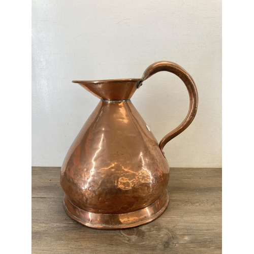 1310 - Two Victorian copper jugs - largest approx. 37cm high