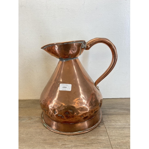 1310 - Two Victorian copper jugs - largest approx. 37cm high