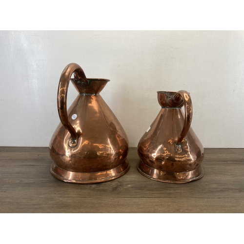 1310 - Two Victorian copper jugs - largest approx. 37cm high