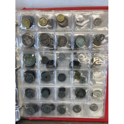 1408 - A coin album containing world coins to include silver examples