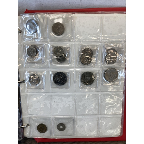 1408 - A coin album containing world coins to include silver examples