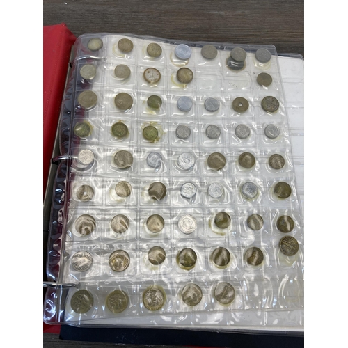 1408 - A coin album containing world coins to include silver examples