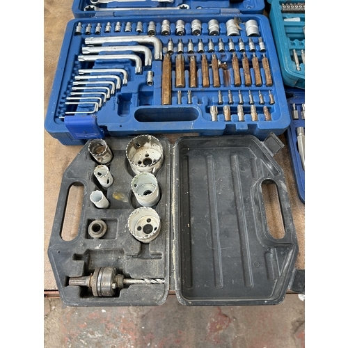 1579 - Four cases containing socket sets, Makita drill bit set, Draper Expert set, Sealy, screwdrivers, hol... 