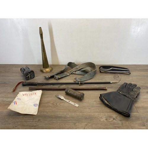 1410 - A collection of items to include English made leather gloves, beret, WWII RAF tachometer etc.