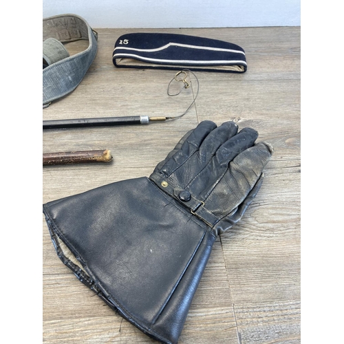 1410 - A collection of items to include English made leather gloves, beret, WWII RAF tachometer etc.