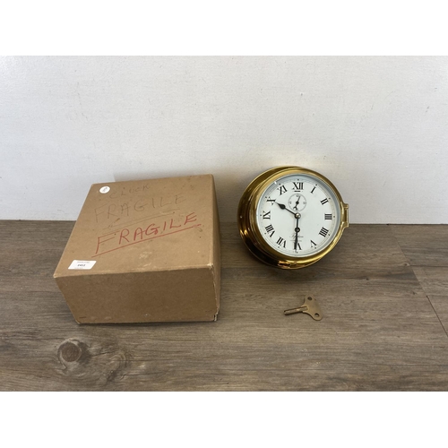 1411 - A boxed Topsham of Exeter brass cased circular ship's wall clock - approx. 20cm high