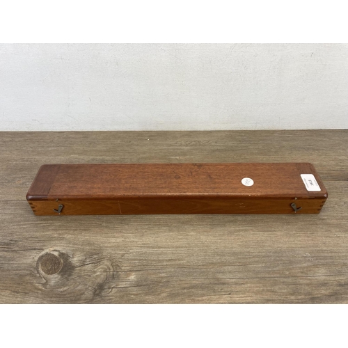 1413 - A mahogany cased U.W.W. Makers of Birmingham brass marine navigation rolling rule - approx. 46cm wid... 