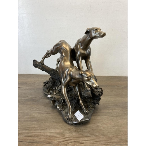 1431 - An Academy bronzed resin figurine of two greyhounds - approx. 32cm high