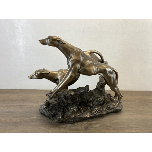 1431 - An Academy bronzed resin figurine of two greyhounds - approx. 32cm high