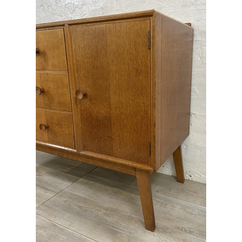 1176 - A mid 20th century Meredew oak sideboard - approx. 85cm high x 114cm wide x 47cm deep