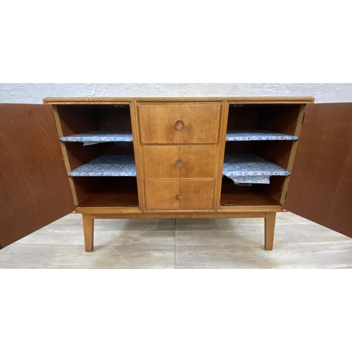 1176 - A mid 20th century Meredew oak sideboard - approx. 85cm high x 114cm wide x 47cm deep