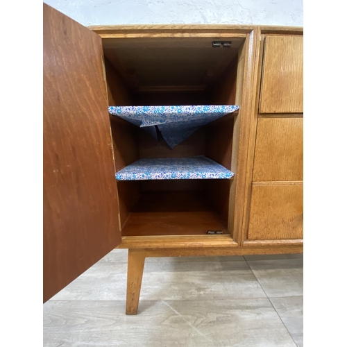 1176 - A mid 20th century Meredew oak sideboard - approx. 85cm high x 114cm wide x 47cm deep