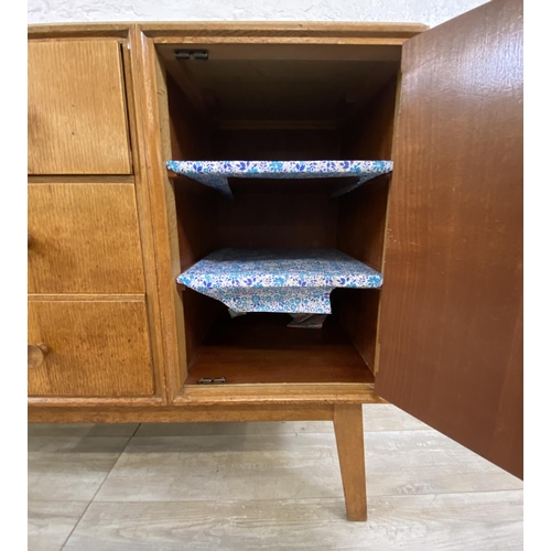 1176 - A mid 20th century Meredew oak sideboard - approx. 85cm high x 114cm wide x 47cm deep