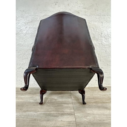 1187 - An oxblood leather Chesterfield wingback armchair - approx. 104cm high x 80cm wide x 75cm deep