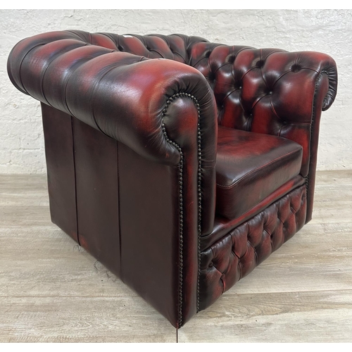 1188 - An oxblood leather Chesterfield club chair - approx. 80cm high x 100cm wide x 86cm deep