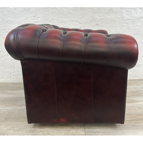 1188 - An oxblood leather Chesterfield club chair - approx. 80cm high x 100cm wide x 86cm deep