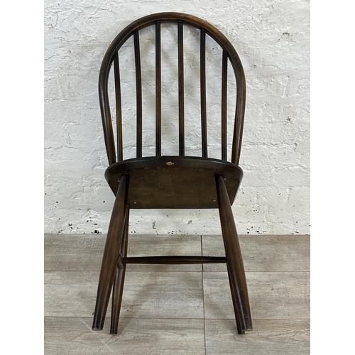 1189 - Four mid 20th century Ercol elm and beech Windsor dining chairs