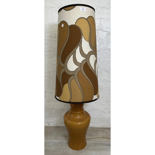 1190 - A mid 20th century brown glazed ceramic table lamp with fabric shade - approx. 106cm high including ... 