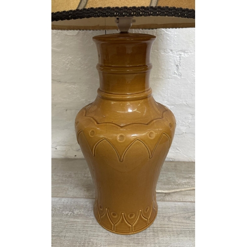 1190 - A mid 20th century brown glazed ceramic table lamp with fabric shade - approx. 106cm high including ... 