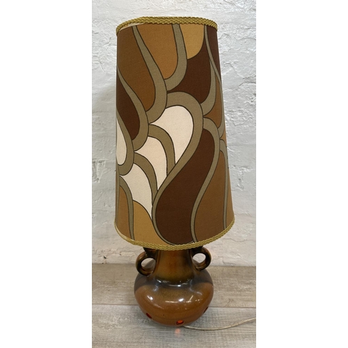 1192 - A mid 20th century West German style ceramic twin handled table lamp with fabric shade - approx. 75c... 