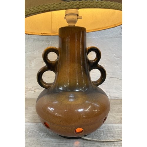 1192 - A mid 20th century West German style ceramic twin handled table lamp with fabric shade - approx. 75c... 