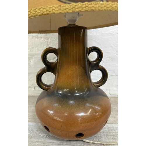 1192 - A mid 20th century West German style ceramic twin handled table lamp with fabric shade - approx. 75c... 