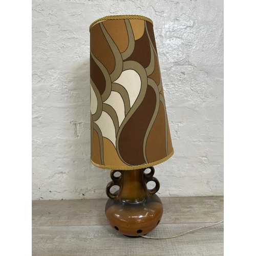 1192 - A mid 20th century West German style ceramic twin handled table lamp with fabric shade - approx. 75c... 