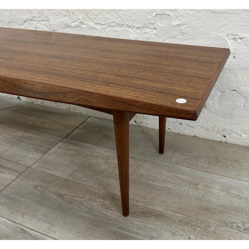 1195 - A mid 20th century Gordon Russell teak coffee table - approx. 40cm high x 45cm wide x 120cm long