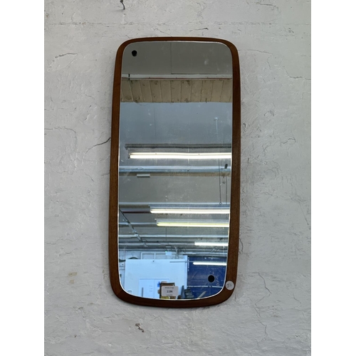 1196 - A mid 20th century teak framed wall mirror - approx. 73cm x 35cm