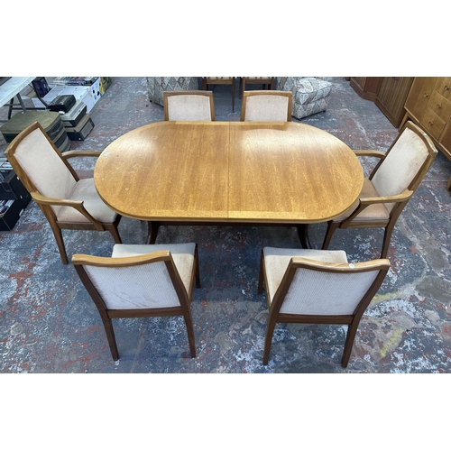 1199 - A mid 20th century Nathan teak extending dining table and six chairs - approx. 74cm high x 104cm wid... 