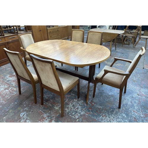 1199 - A mid 20th century Nathan teak extending dining table and six chairs - approx. 74cm high x 104cm wid... 