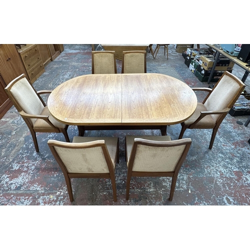 1199 - A mid 20th century Nathan teak extending dining table and six chairs - approx. 74cm high x 104cm wid... 