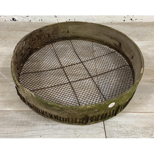 1203 - Three vintage wood and wired metal sieves