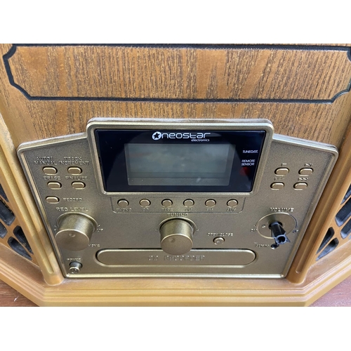 1503 - A Neostar KB111 music centre comprising three-speed turntable, CD recorder, cassette player and two-... 