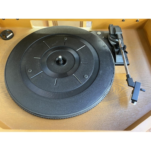 1503 - A Neostar KB111 music centre comprising three-speed turntable, CD recorder, cassette player and two-... 