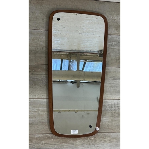 1196 - A mid 20th century teak framed wall mirror - approx. 73cm x 35cm