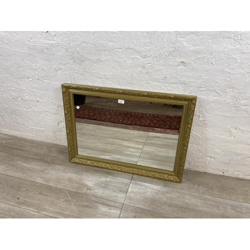 1212 - A modern gilt framed rectangular over mantel wall mirror - approx. 61cm high x 83cm wide