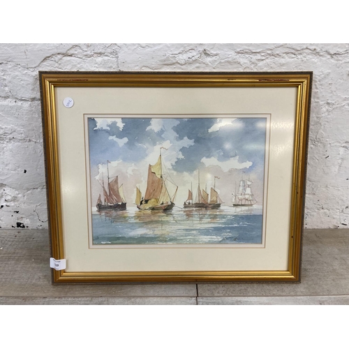 1229 - A late 20th century gilt framed watercolour of sailing ships pencil signed lower right - approx. 43c... 