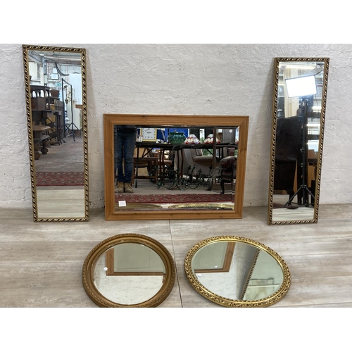 1233 - Five mirrors, one gilt framed oval bevelled edged, one gilt framed circular, one pine framed bevelle... 