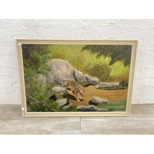 1234 - A mid 20th century framed Digby Sinclair oil on board of a leopard signed and dated 1973 to lower le... 