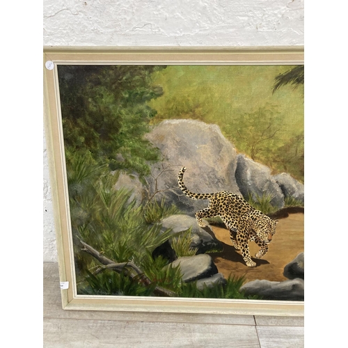 1234 - A mid 20th century framed Digby Sinclair oil on board of a leopard signed and dated 1973 to lower le... 