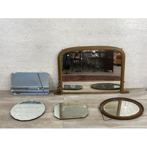 1241 - Five mid 20th century and later wall mirrors, one overmantle, one circular bevelled edge, one wooden... 