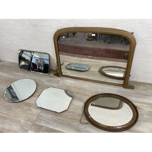 1241 - Five mid 20th century and later wall mirrors, one overmantle, one circular bevelled edge, one wooden... 