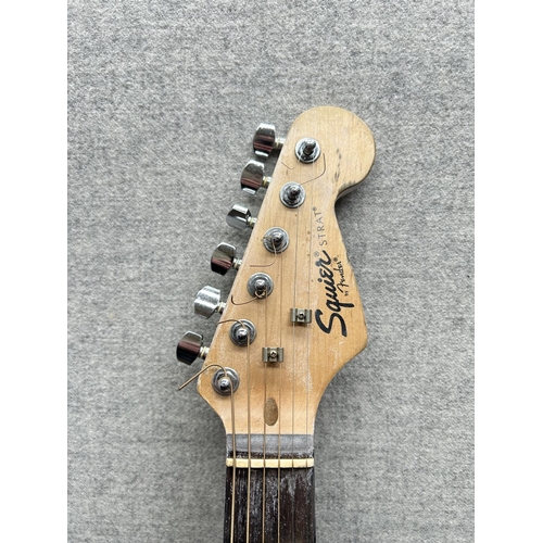 1508 - A cased Squire By Fender Stratocaster electric guitar