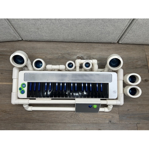 1509 - A Blue Man Group electronic keyboard with Gesture-Activated percussion