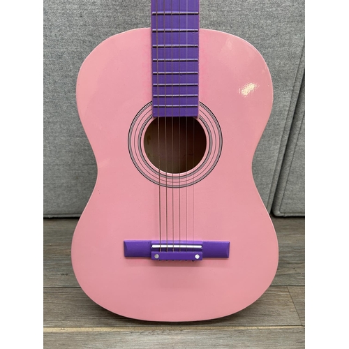 1514 - A Ready Ace pink and purple child's steel strung acoustic guitar