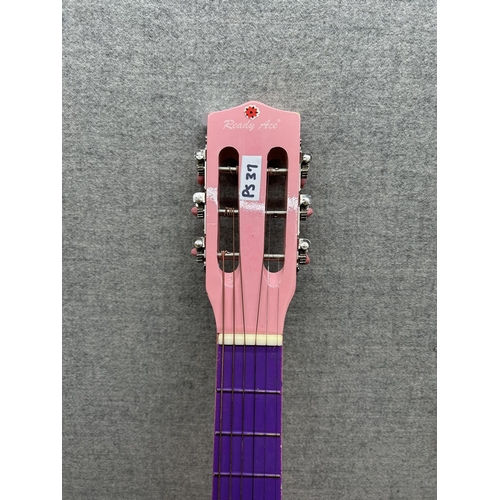 1514 - A Ready Ace pink and purple child's steel strung acoustic guitar