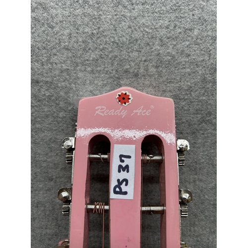 1514 - A Ready Ace pink and purple child's steel strung acoustic guitar