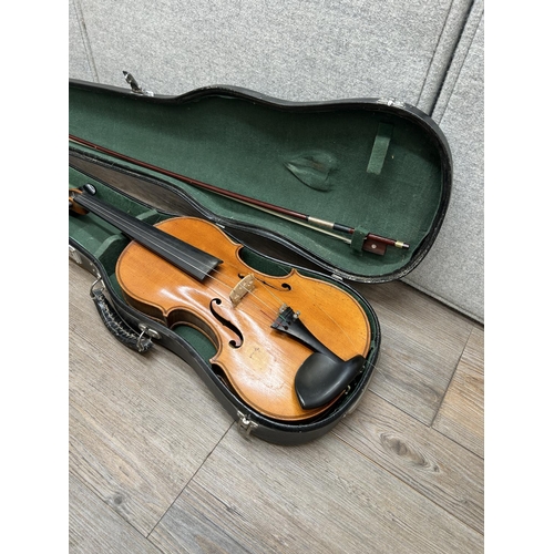 1517 - A cased vintage unlabelled violin with bow